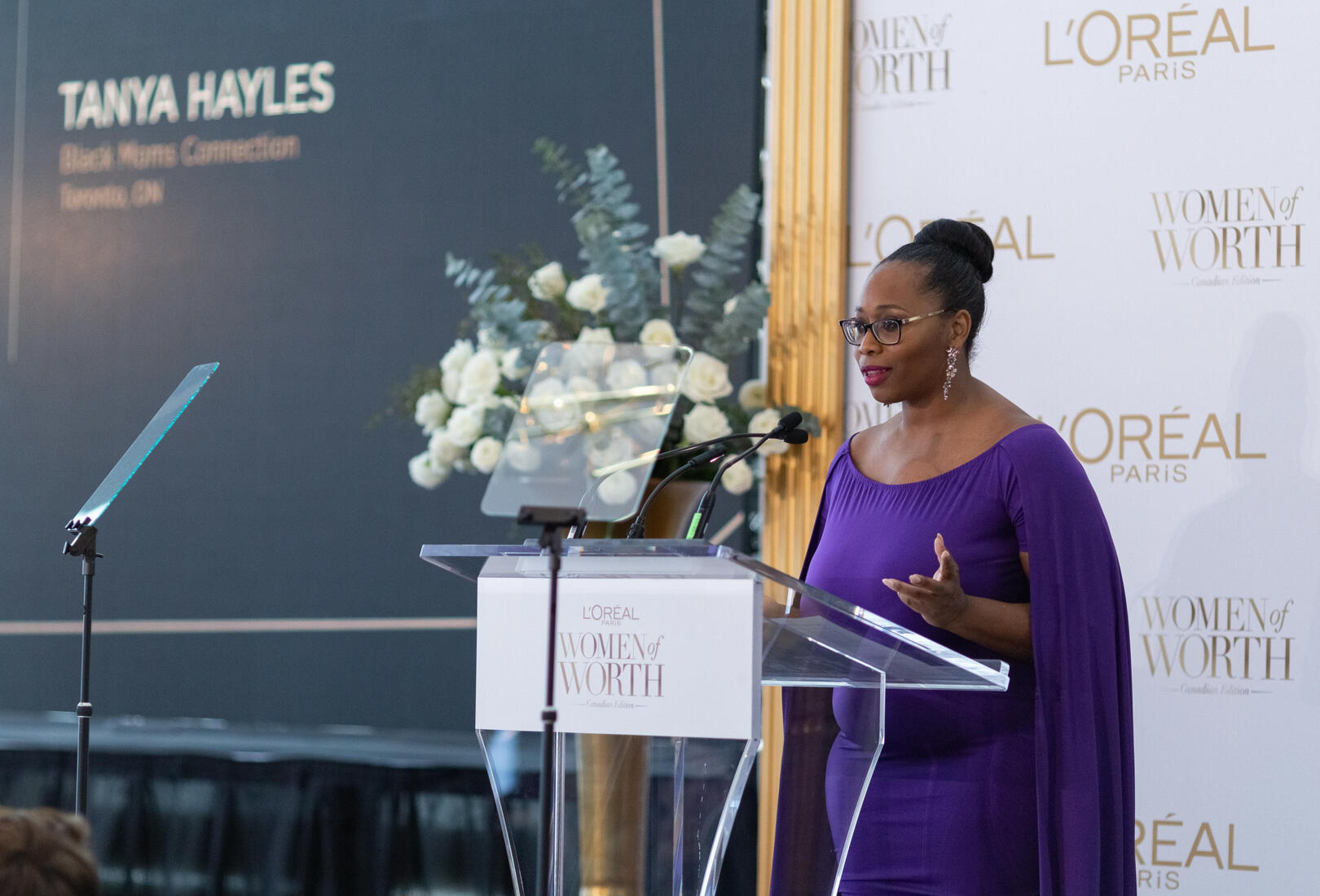 Tanya Hayles L'Oreal Women of Worth Tanya Hayles at podium accepting L'Oreal Paris Women of Worth award at 2020 gala